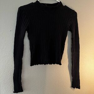 ribbed black long sleeve shirt with ruffle detail